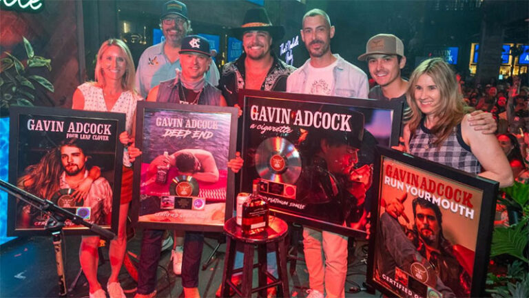 Gavin Adcock surprised on stage with new RIAA certifications